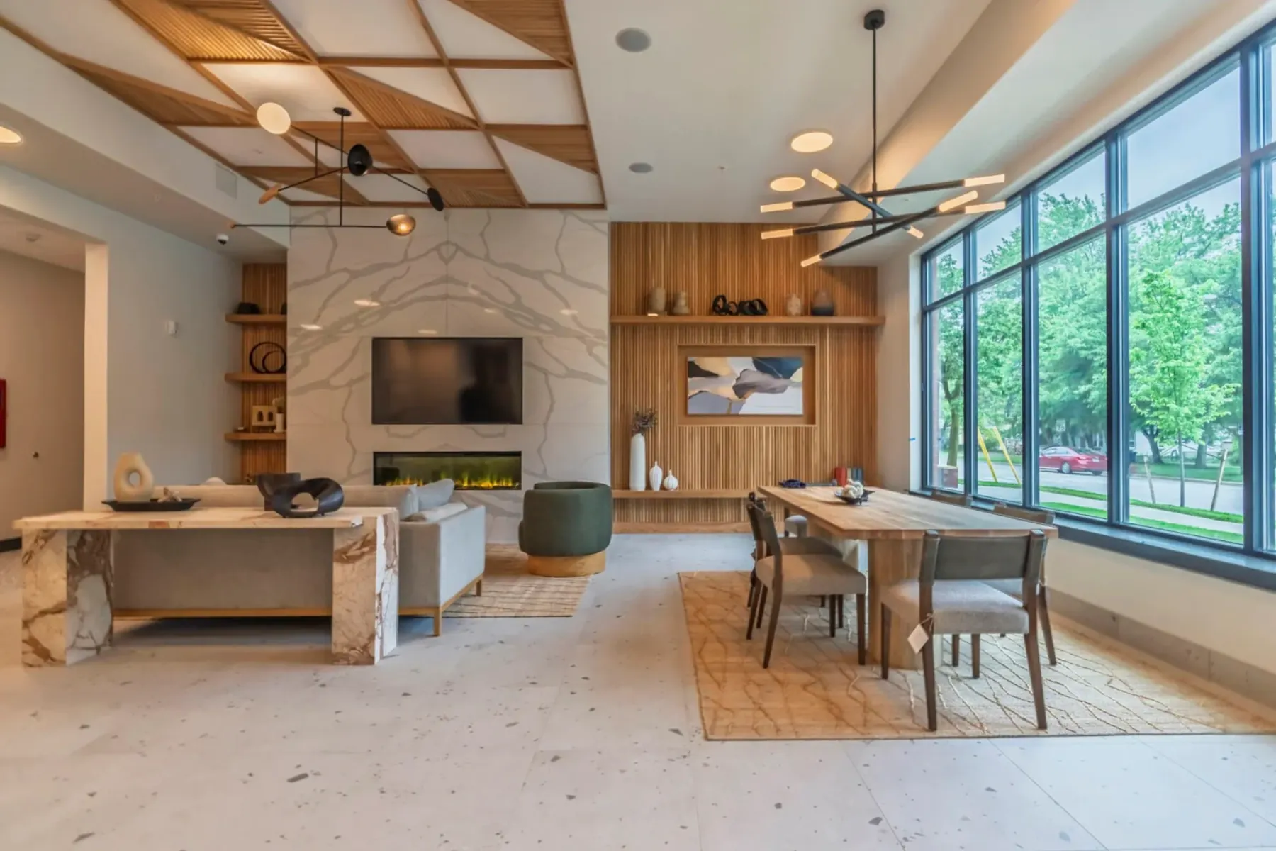 Packard Row clubhouse with marble fireplace and floor-to-ceiling windows